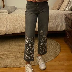 High waisted Black Jeans with bleached smiley face pattern